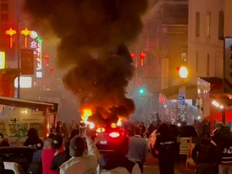 A Waymo self-driving robotaxi, owned by Alphabet's autonomous driving unit, is engulfed in flames after the San Francisco Fire Department said in a statement on social media that fireworks were thrown inside the vehicle, in San Francisco, California February 10, 2024 in a still image from video. Courtesy of Michael Vandi/ via REUTERS