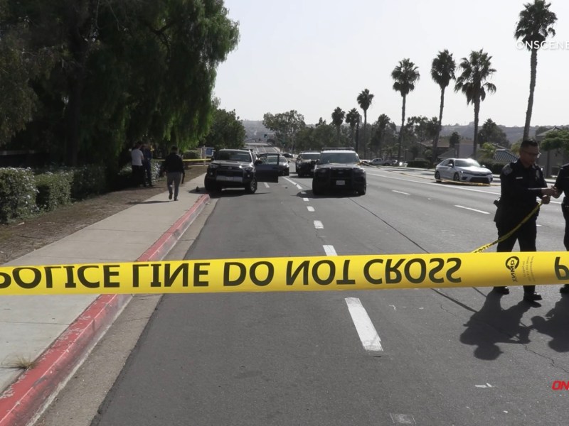 Scene with police tape at Dairy Mart Road and Vista Lane in San Ysidro, where a stabbing attack suspect was found dead.