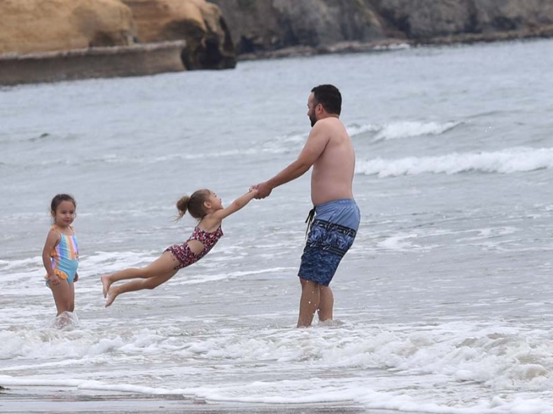 People played in the ocean despite the lack of sunshine on Memorial Day in La Jolla. Photo by Chris Stone