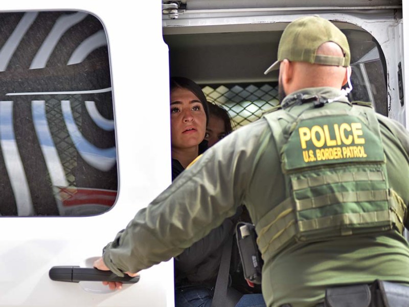 Woman are taken by Border Patrol for immigration processing. Photo by Chris Stone