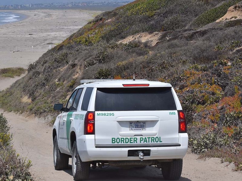 A Border Patrol agent drives down to the beach. Photo by Chris Stone