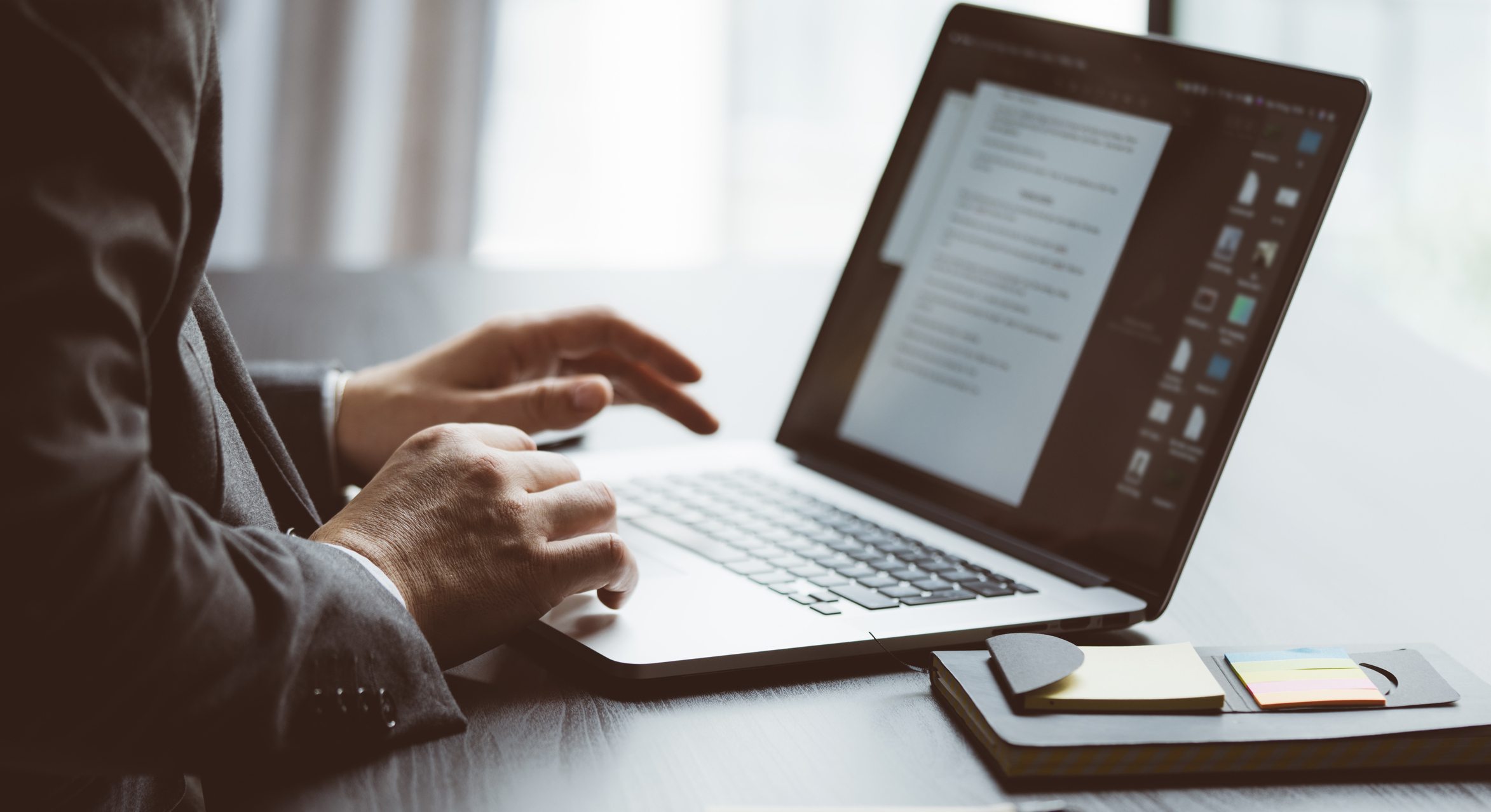 Business-man-writing-on-laptop-best-resume-builders