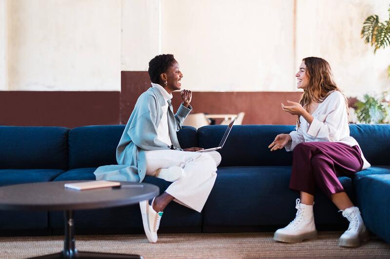 Coworkers-Talking-On-Sofa-how-to-connect-with-people