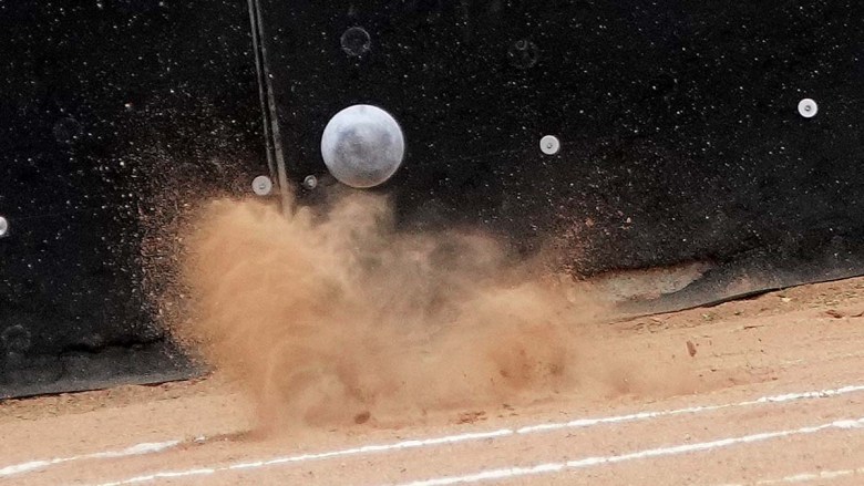 A Joe Kovacs shot kicks up dirt at the L.A. Grand Prix competition. Photo by Chris Stone