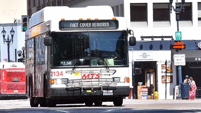 Riders on MTS buses wear face coverings. Photo by Chris Stone