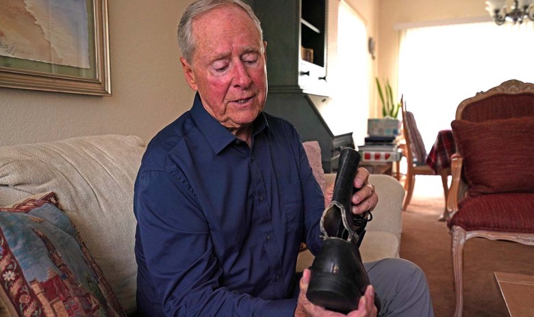 Retired SEAL Robert Rohrbach talks about his boots that helped him survive SEAL training. Photo by Chris Stone