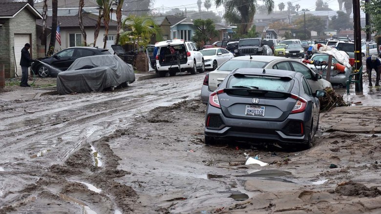 A river of storm water damages 42nd St. Photo by Chris Stone