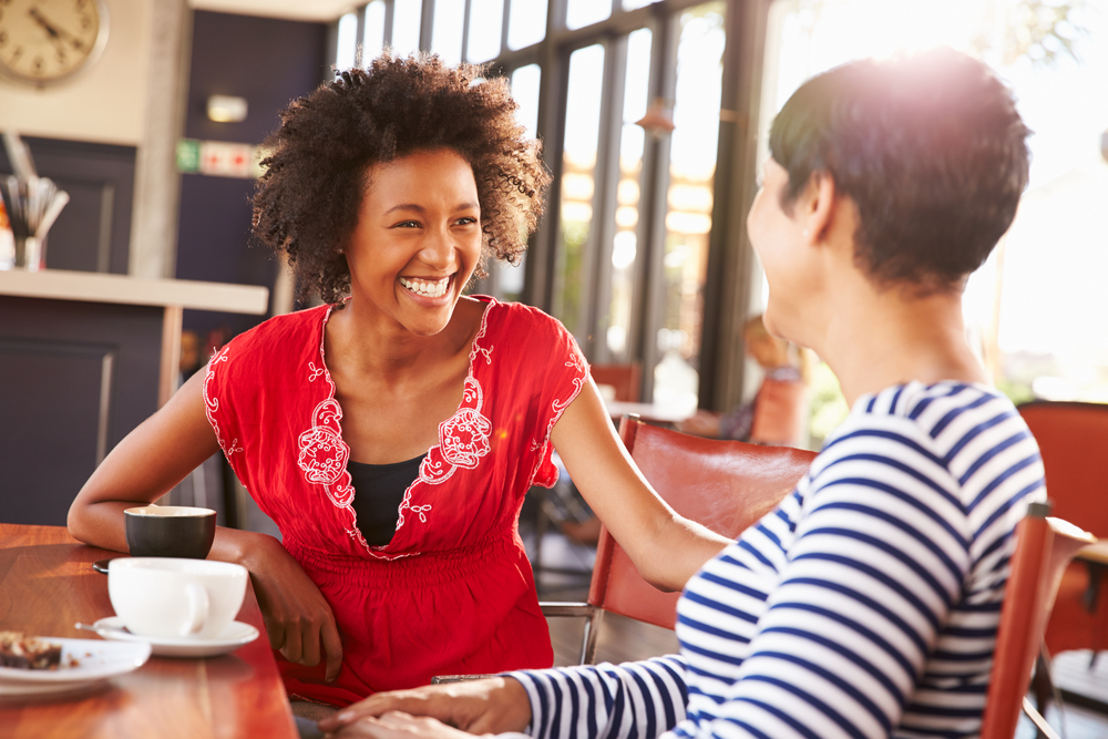 two-female-friends-talking-at-coffee-shop-how-to-answer-why-do-you-want-to-work-here