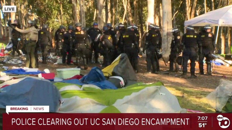 Officers clean encampment