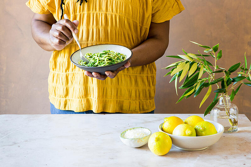 woman-eating-green-lemon-pasta-personal-goals